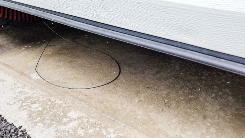 garage door cable on ground